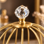 Close-up of the faceted crystal finial on the cage organizer