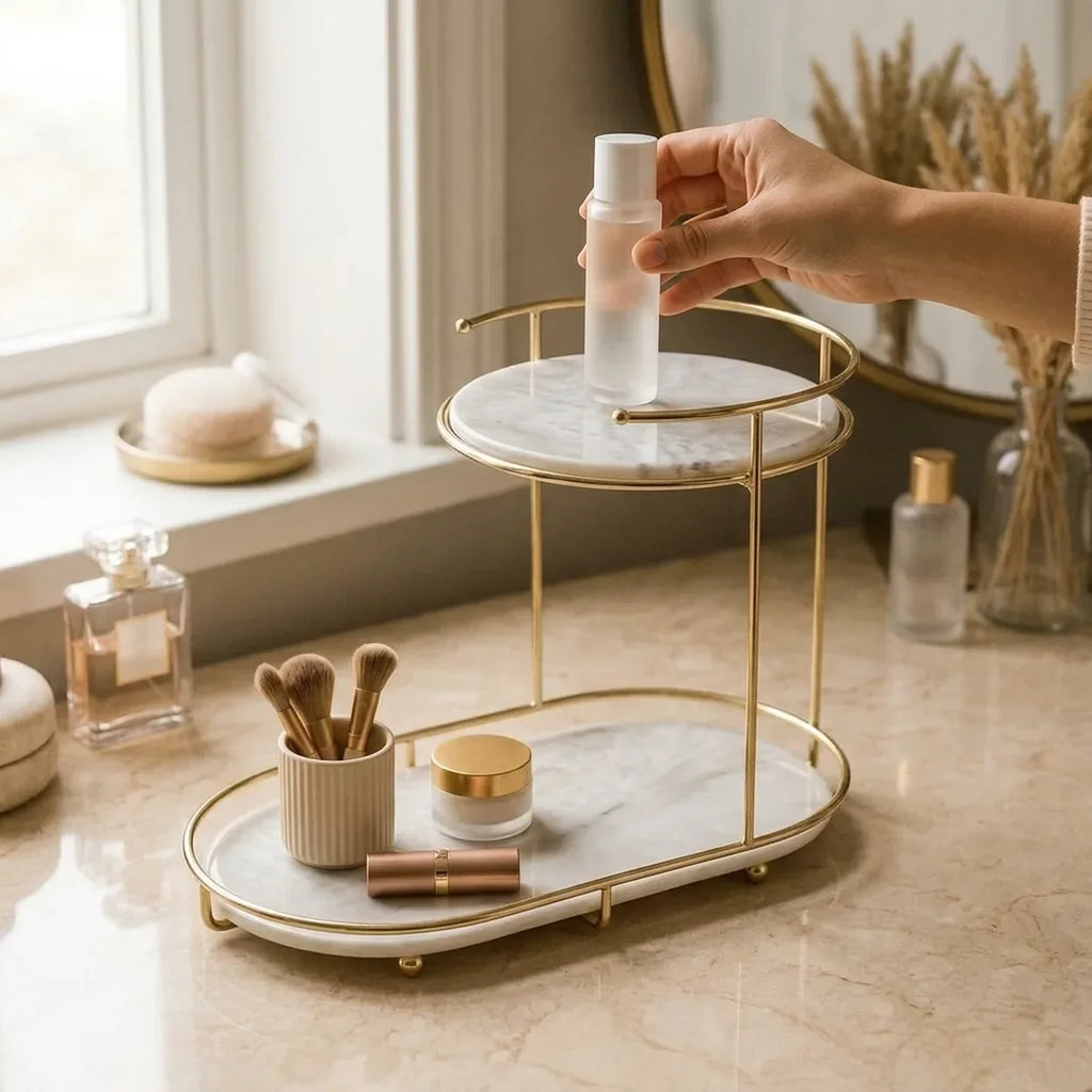 A hand placing a bottle on the free-standing two-tier organizer, showing its true size