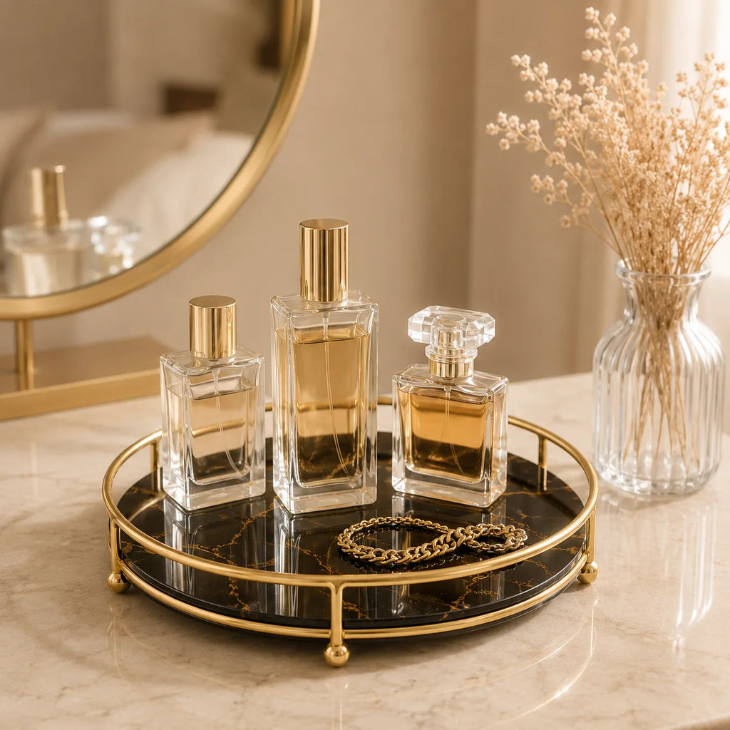 Perfume tray styled with bottles and a gold chain