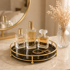 Perfume tray styled with bottles and a gold chain