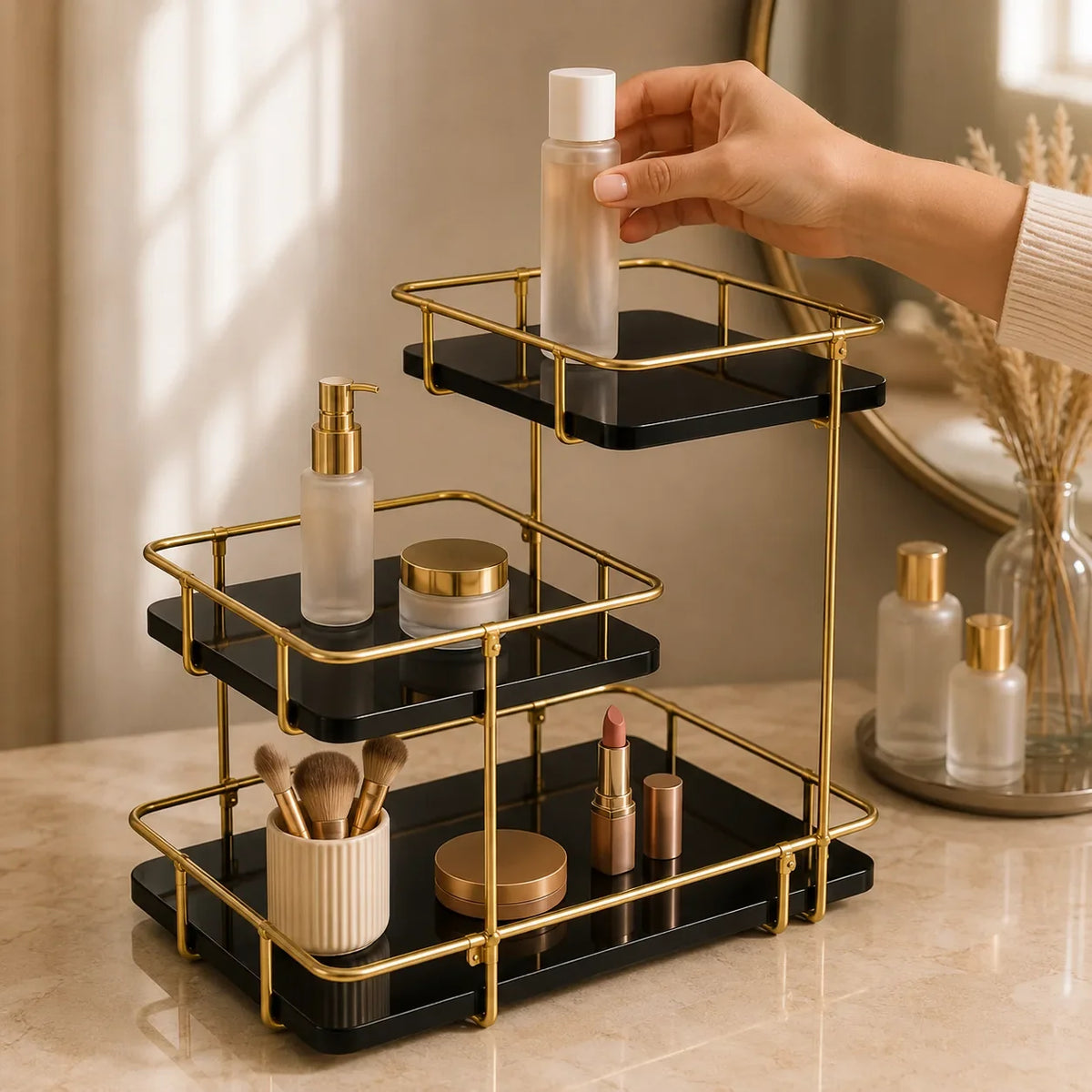 Modern stepped three-tier organizer in Onyx holding skincare and brushes on a vanity
