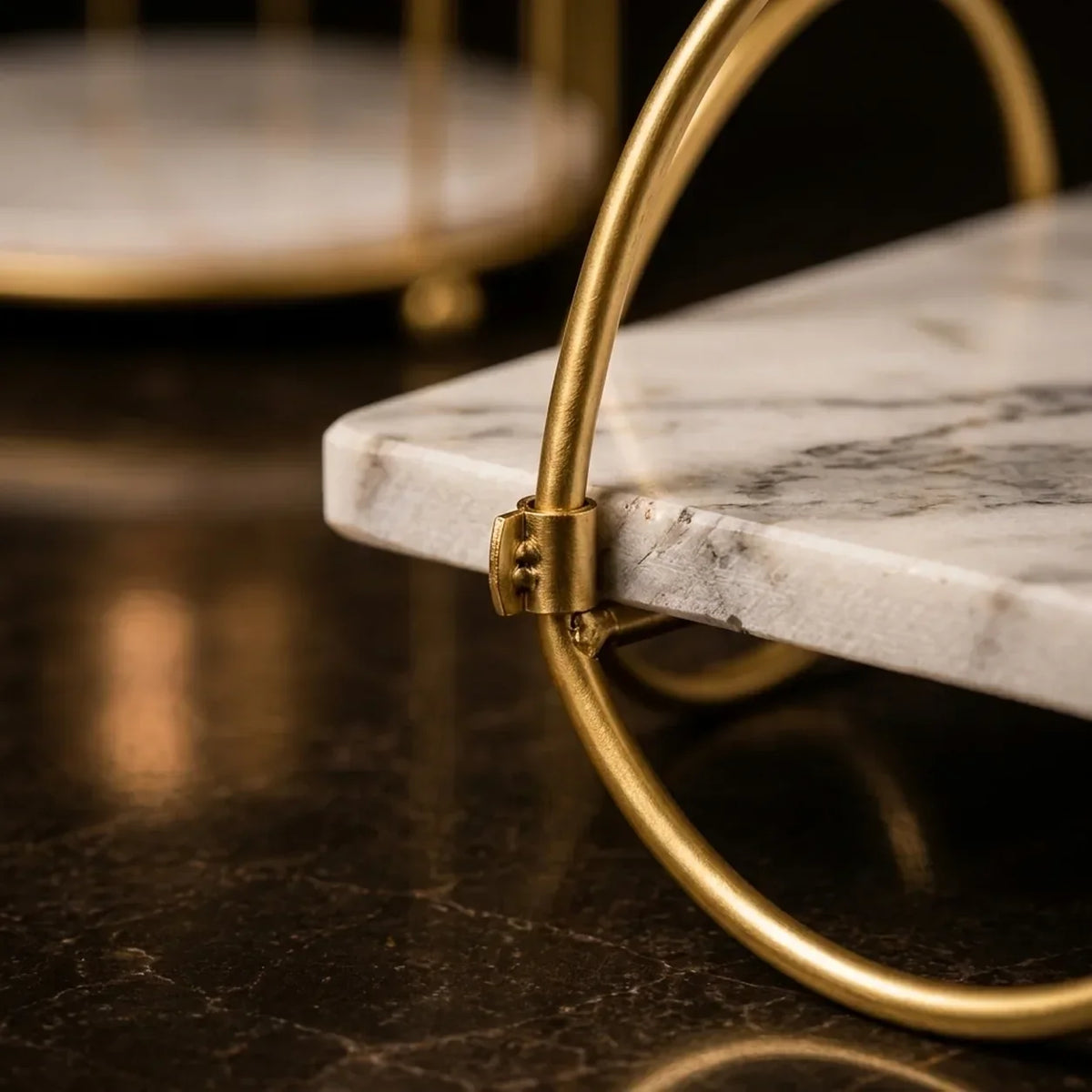 Close-up of the marble shelf passing through the gold ring frame